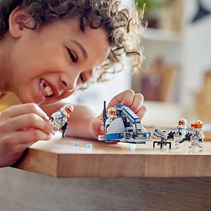 Child playing with Lego Star Wars 332nd Ahsoka's Clone Trooper Battle Pack.