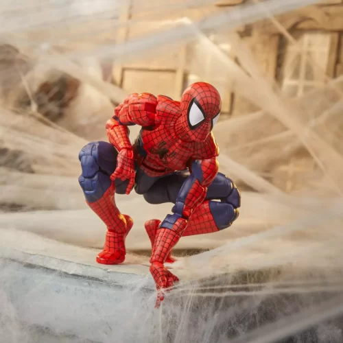 Hasbro Marvel Legends Maximum Series Spider-Man crouching on roof top with webs in the background.