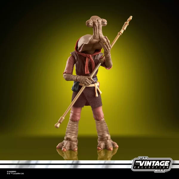 Hasbro Star Wars The Vintage Collection Momaw Nadon with staff in one hand and touching his face with the other hand.
