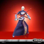 Hasbro Star Wars The Vintage Collection Asajj Ventress with light sabers crossed in front of her.