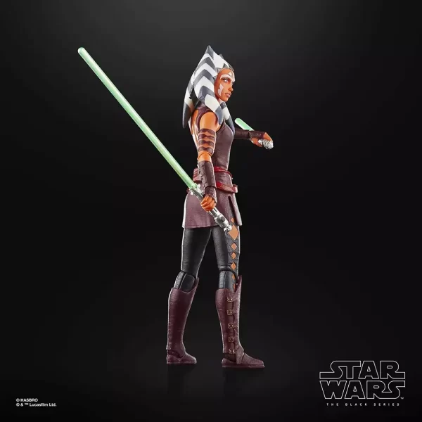 Hasbro Star Wars The Black Series Ahsoka Tano Padawan with lit lightsaber behind her back.