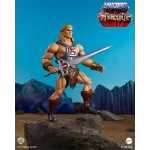 Mattel Masters of the Universe Origins x Thundercats He-Man. Posed with his sword at side with Eternia in the background.
